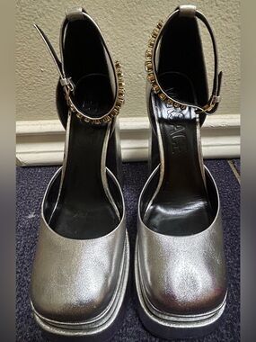 Versace Silver Metallic Platform Ankle-Strap Pumps with gold accents.